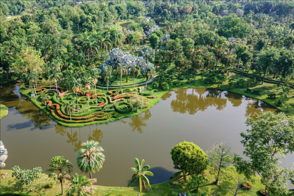 Horizon Village in Chiang Mai from above, lush green garden with a lake