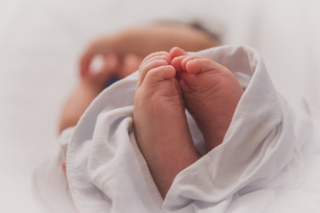 Baby feet in a white sheet, baby in thailand