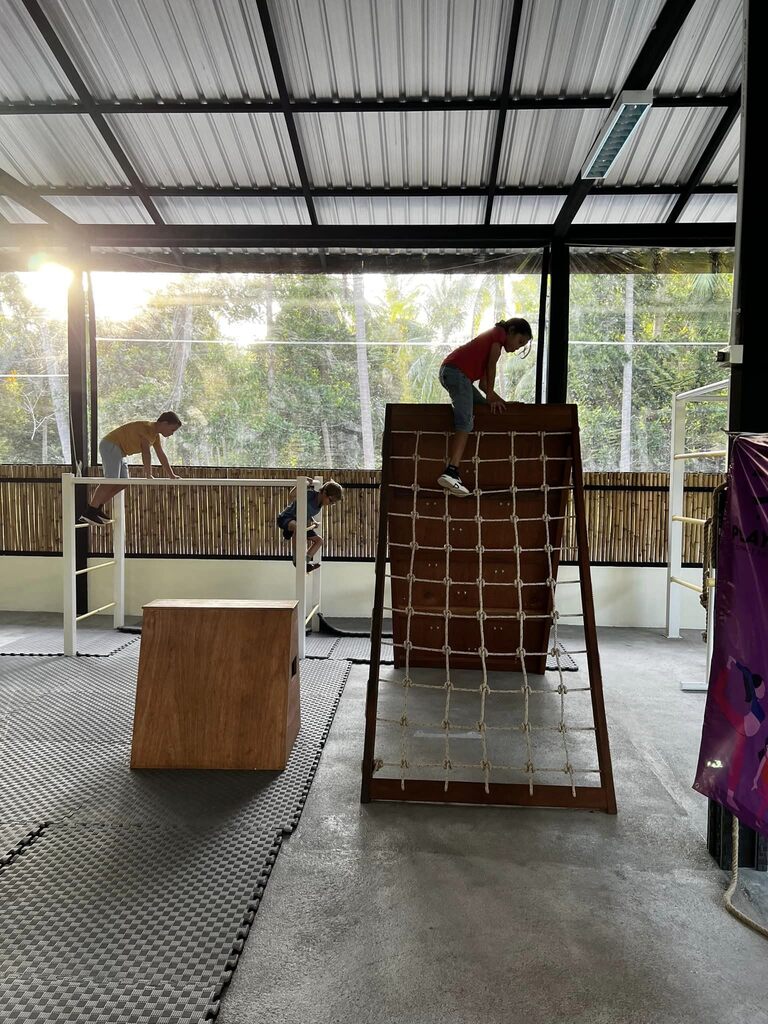 Kids playing on a wooden playground