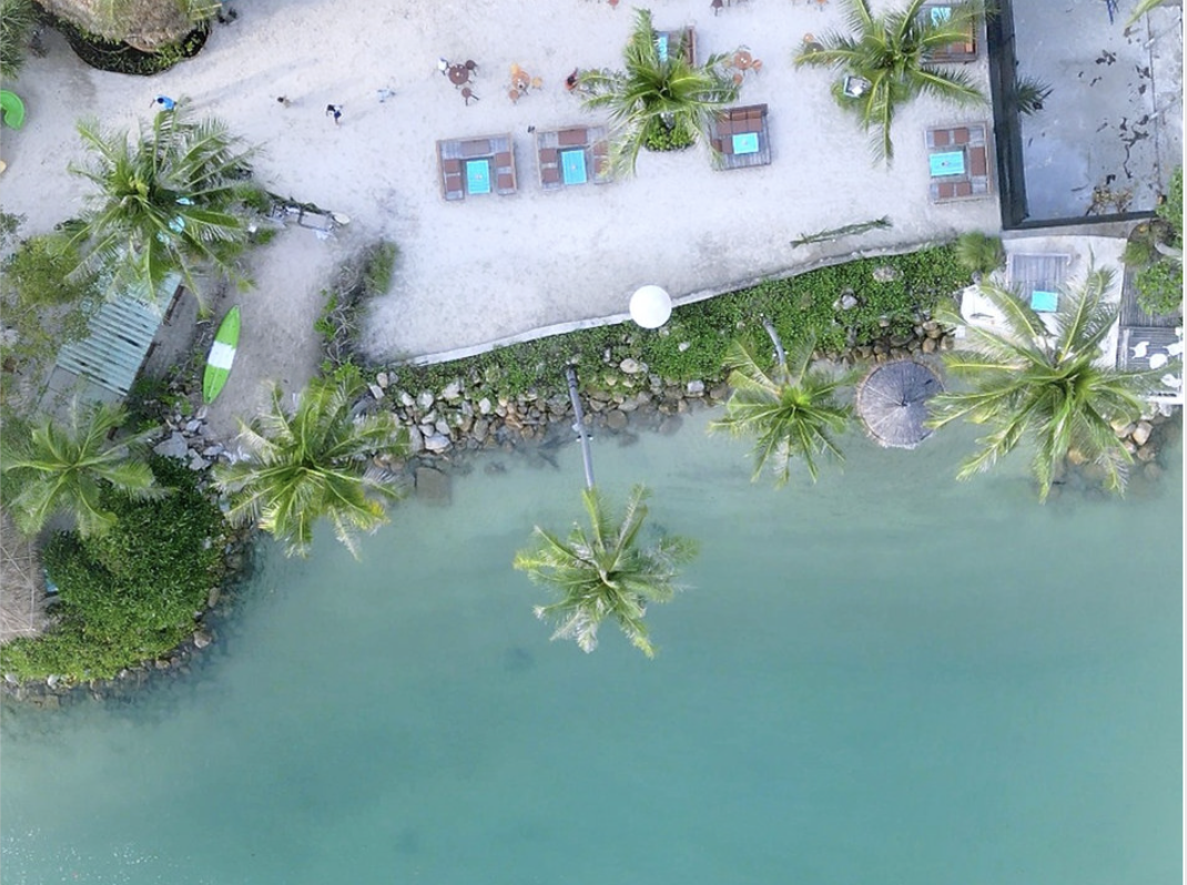 Beach with tables and sunbeds