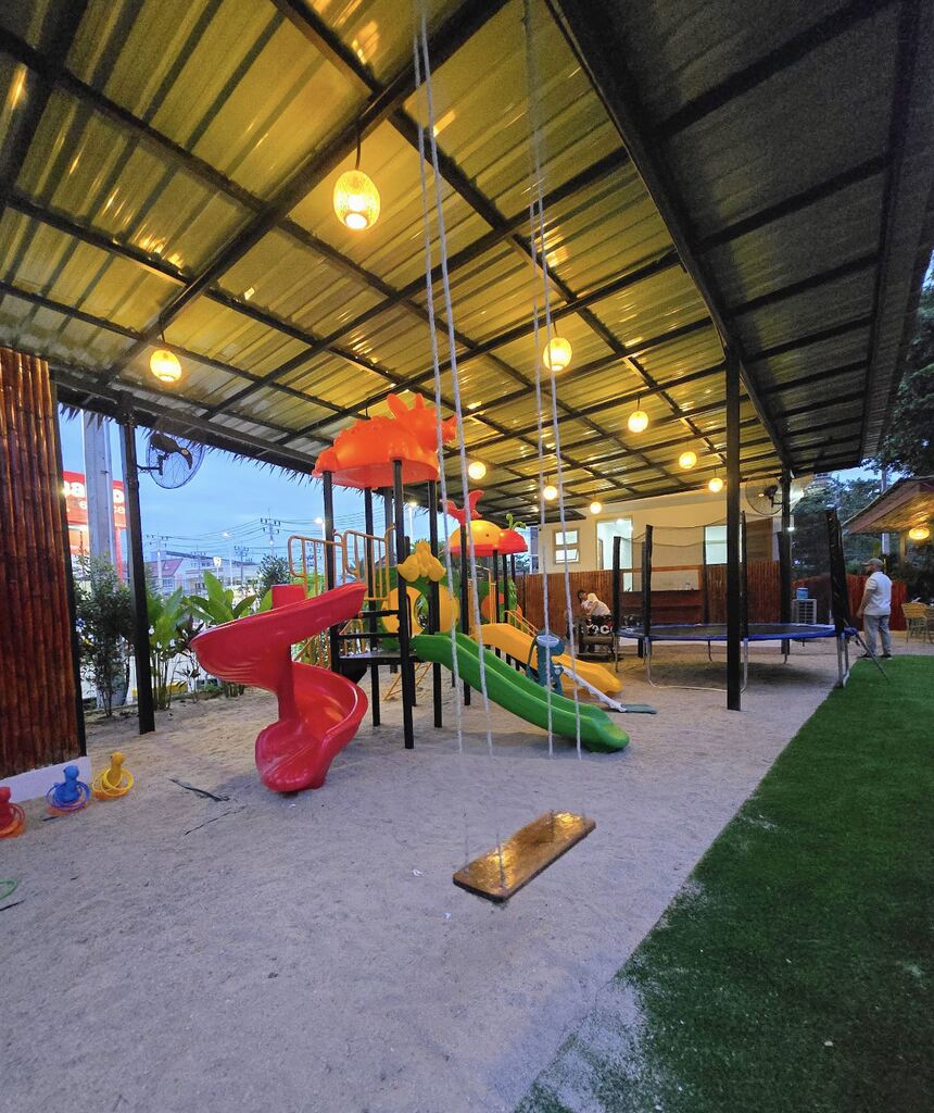 Colorful playground with swings and slides.