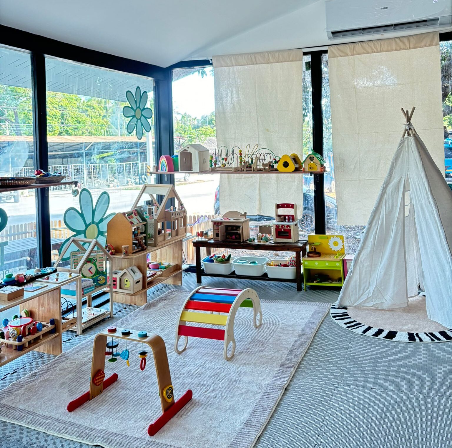 indoor playground with tent and wooden toys, international kindergarten in koh phangan