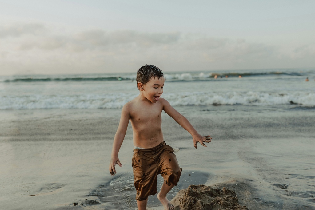 Child playing at the beach.