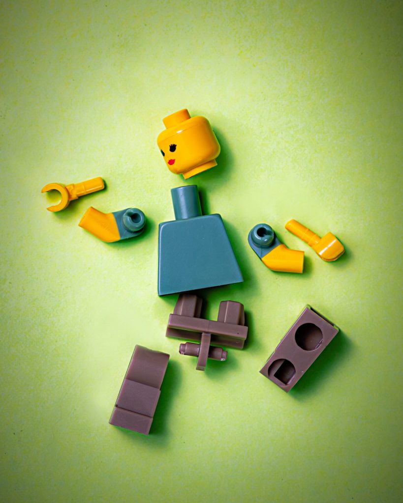 Parts of a lego figure lying on the ground