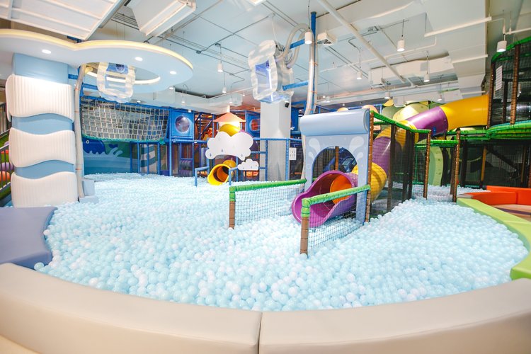 Big ball pool with light blue balls and colorful kids toys, indoor playground bangkok