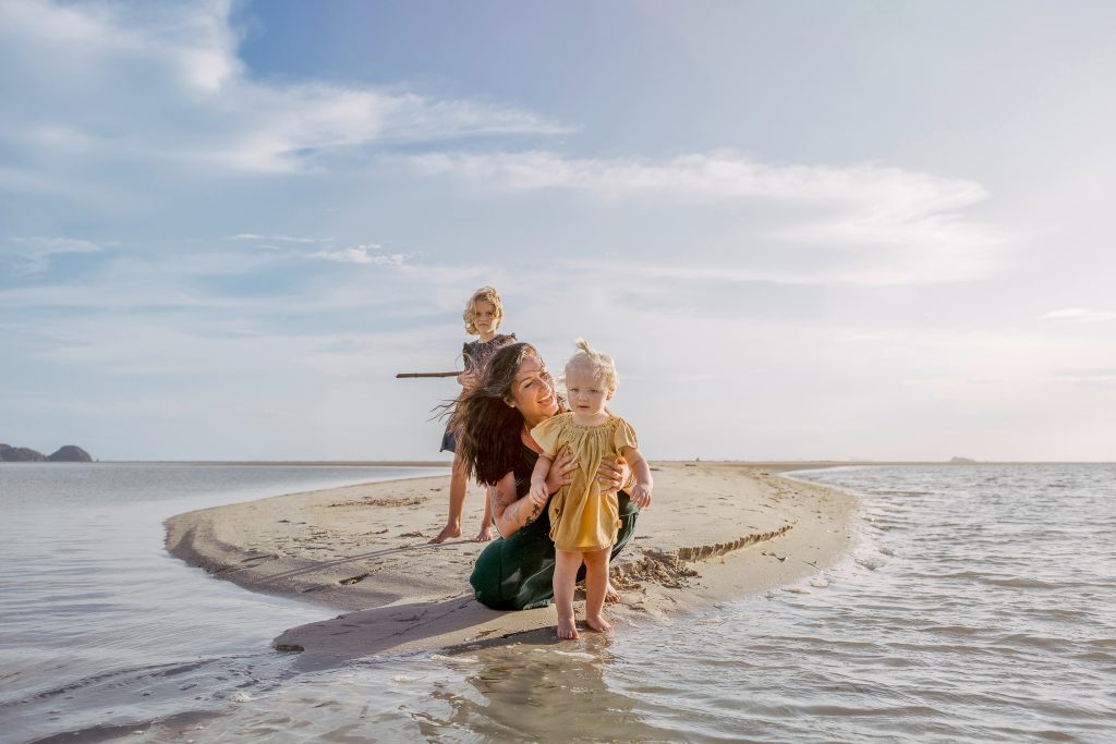 Digital Nomad Family in Thailand, on the beach, mum with two children