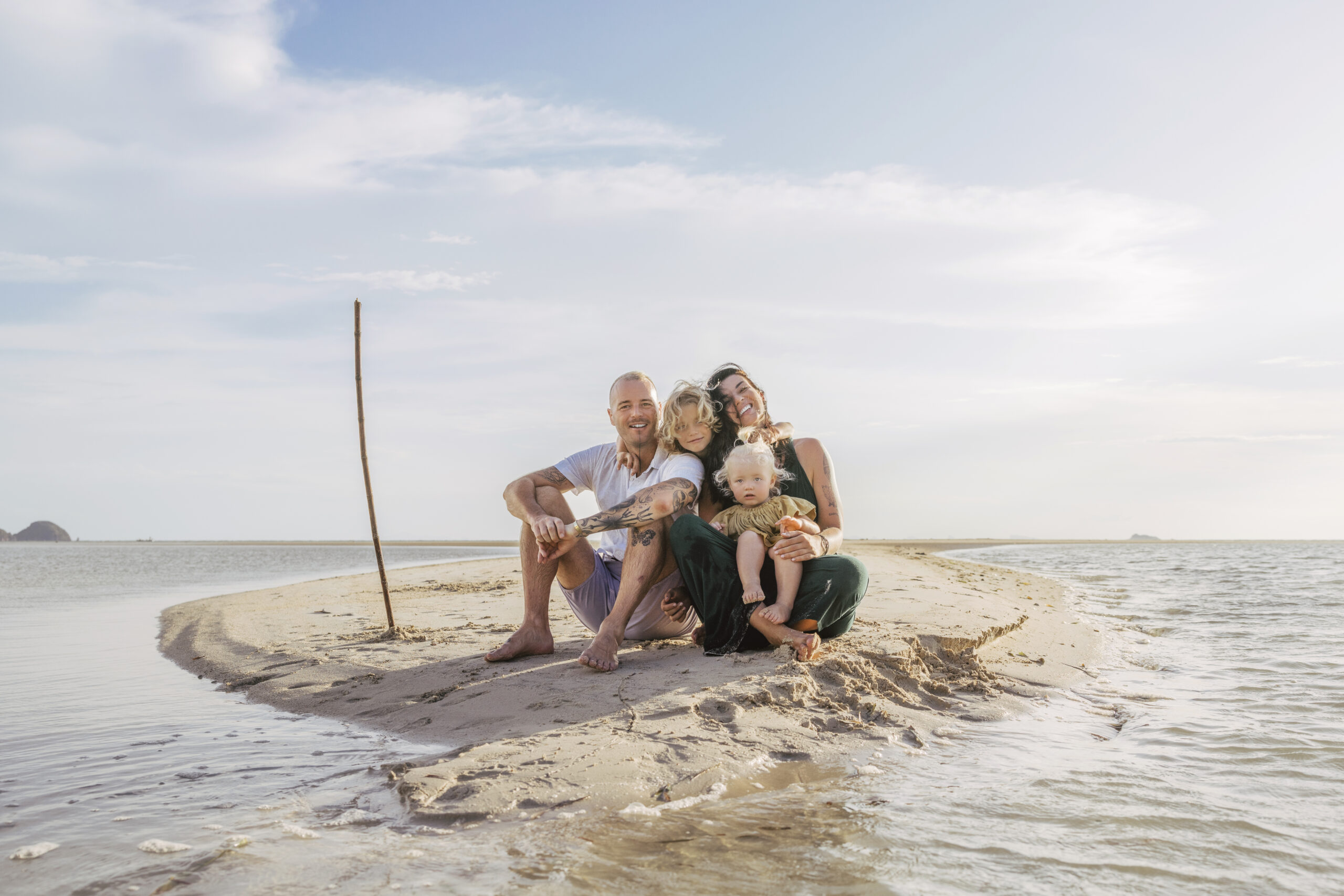 Digital Nomad Family with two kids sitting on the beach, How to become a Digital Nomad Family