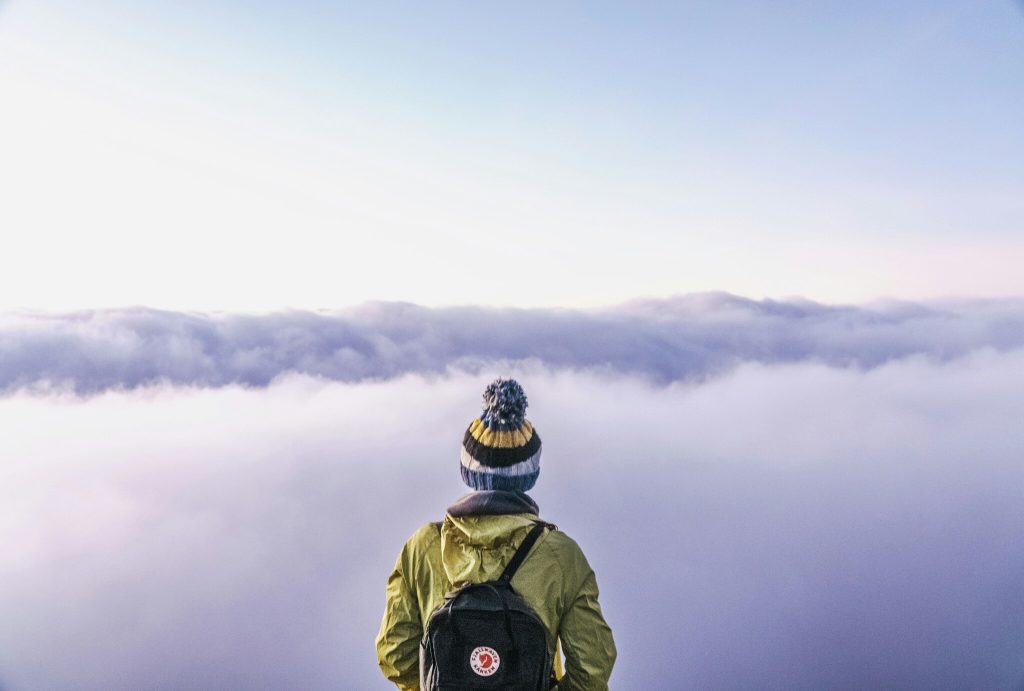 Traveler standing in front of a cloud