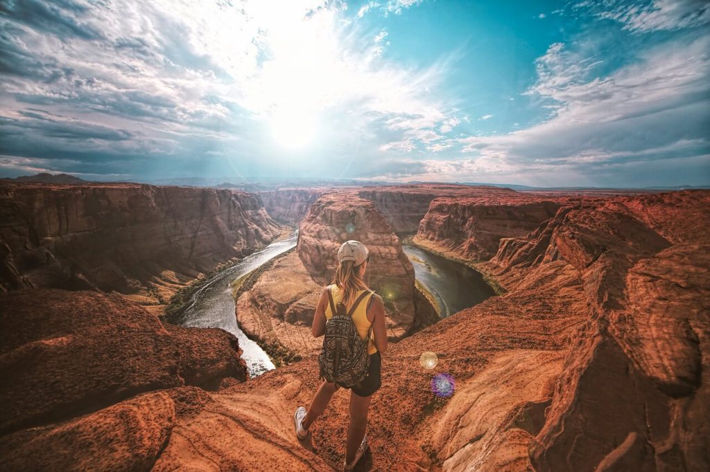 A woman traveler standing in front of the grand canyon