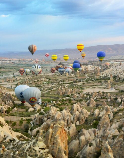 Birds view over cappadocia in Turkey with many colorful hot air balloons, Digital nomad visa turkey