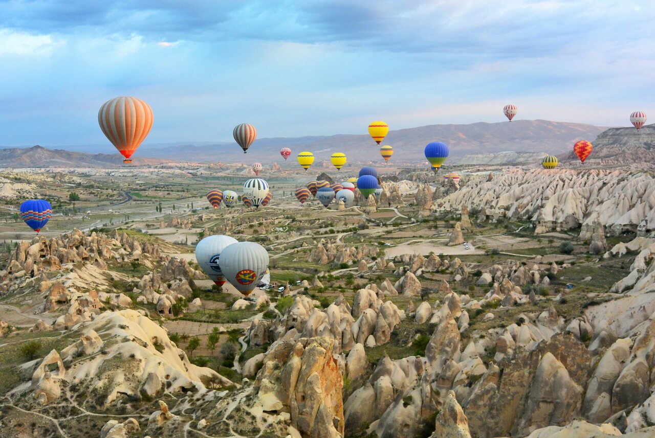 Birds view over cappadocia in Turkey with many colorful hot air balloons, Digital nomad visa turkey