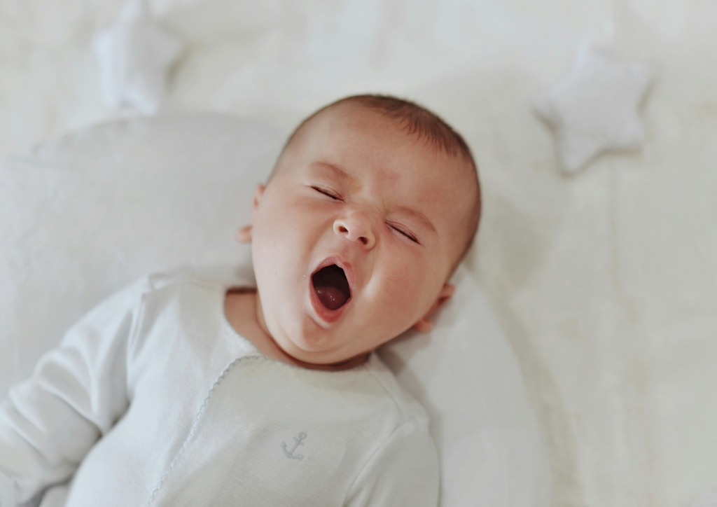 a baby yawns, digital nomad with a baby