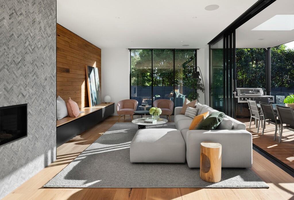 a bright and modern living room with gray sofa and wooden floor