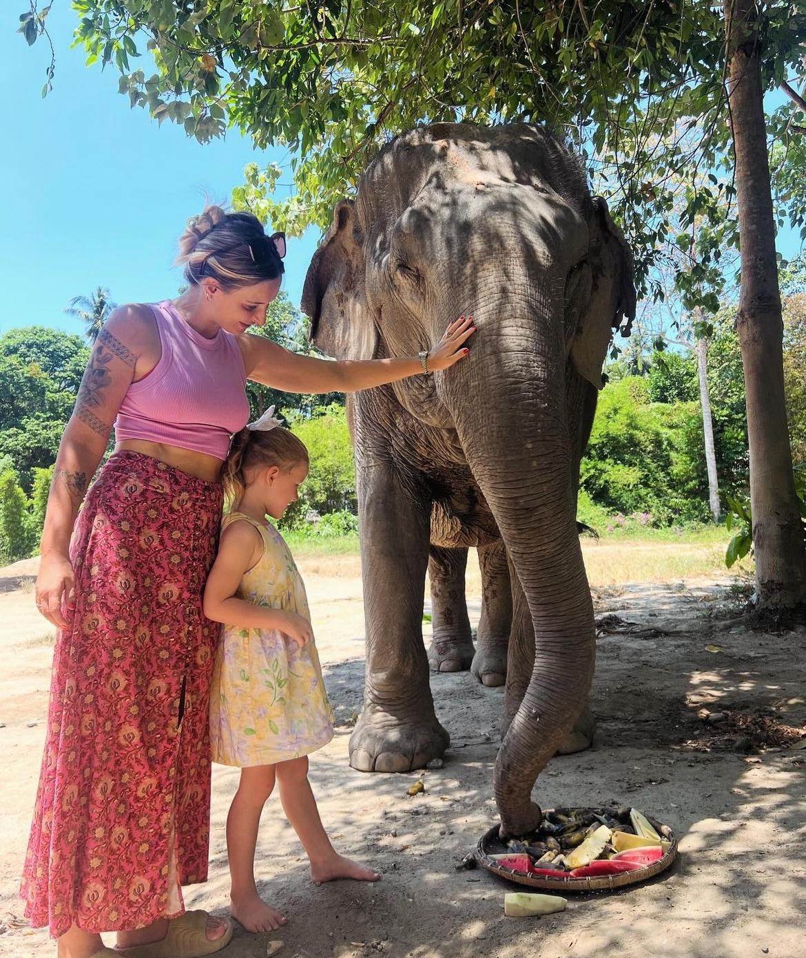 Mom and daughter petting an elephant in Madue Wan, one of the best areas in Koh Phangan for families