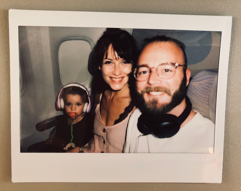 Family of three sitting in an airplane