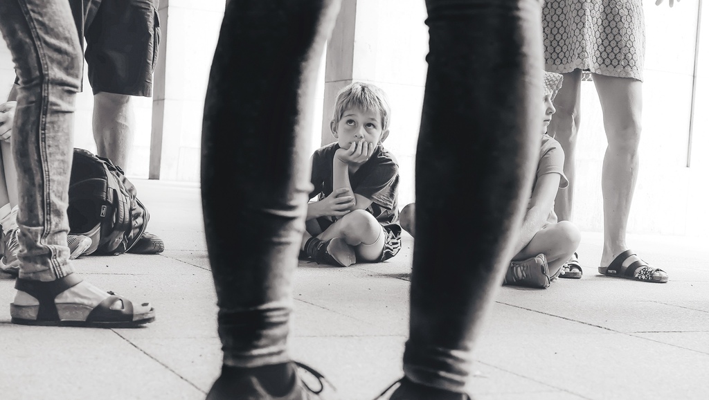 Little boy sitting on the ground