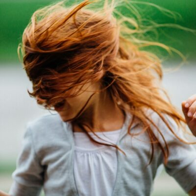 Red haired girl dancing