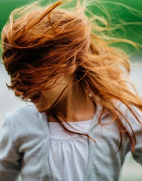 Red haired girl dancing