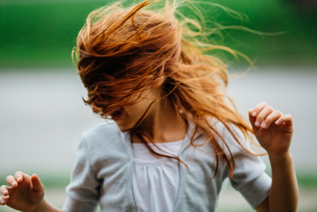 Red haired girl dancing