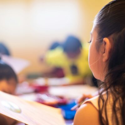 Young girl studying with a book