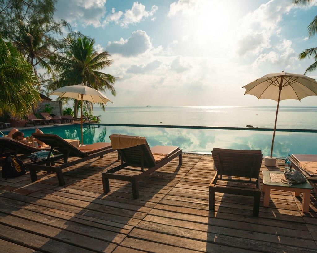 sun beds at a pool on the beach