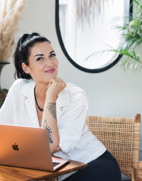 Woman sitting in front of her laptop