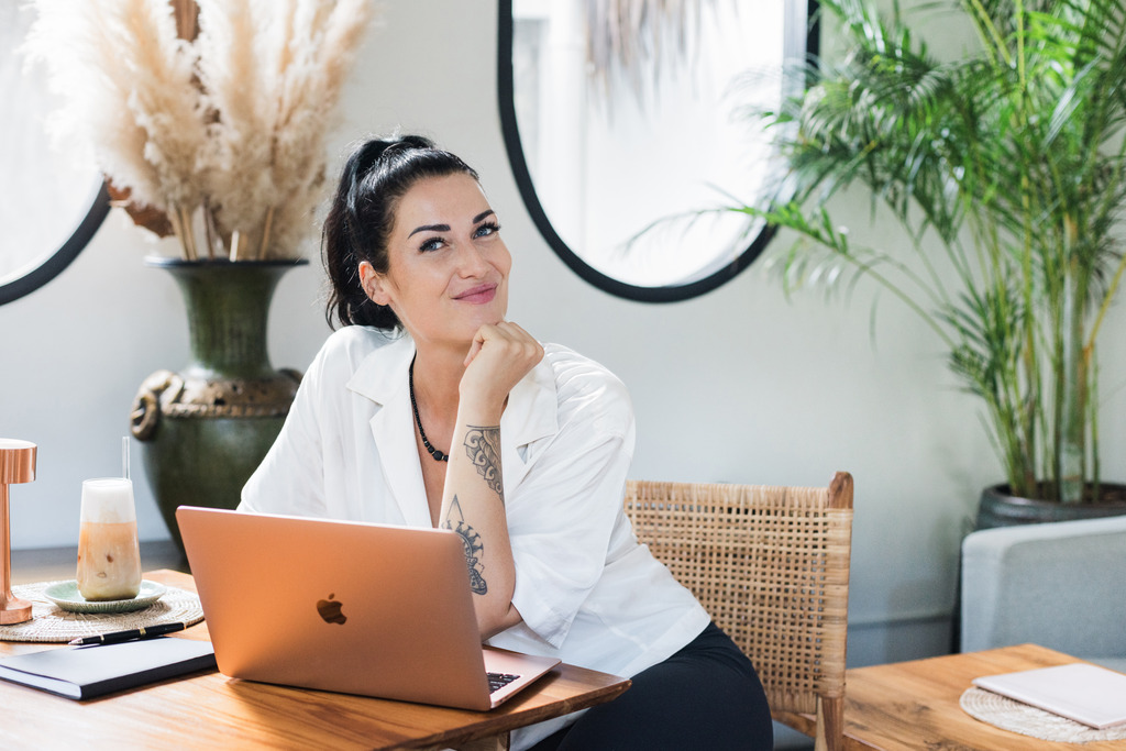 Woman sitting in front of her laptop