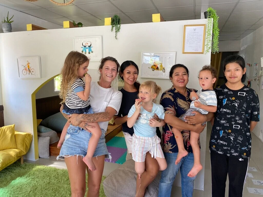 Group of kindergarten teachers with three kids