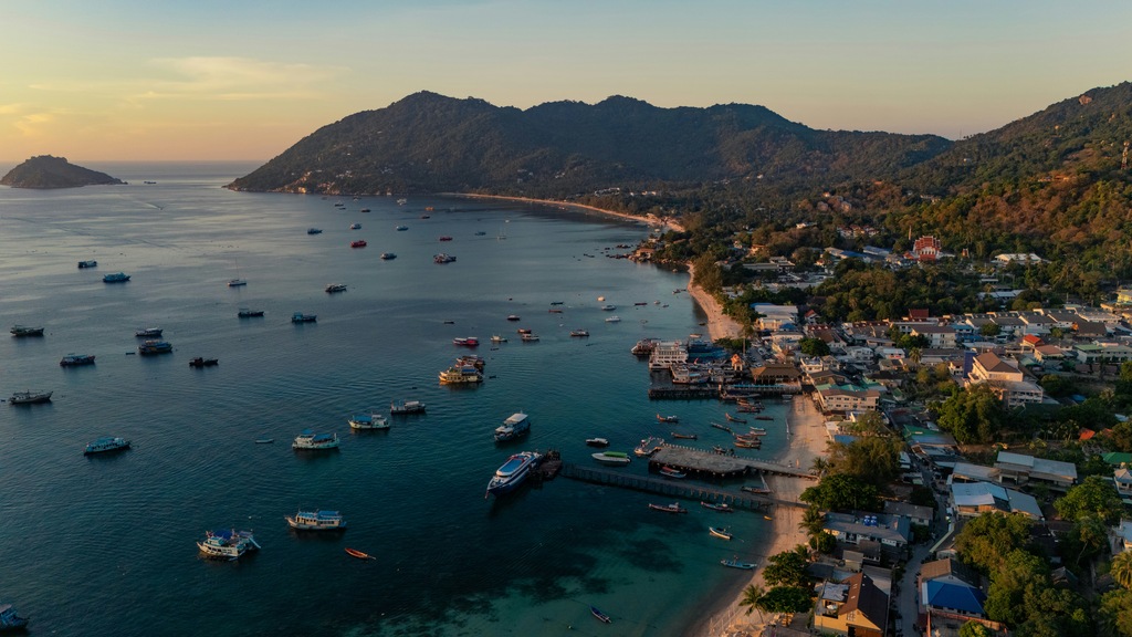 Aerial view of a tropical beach with boats on the sea, Koh Tao cost of living