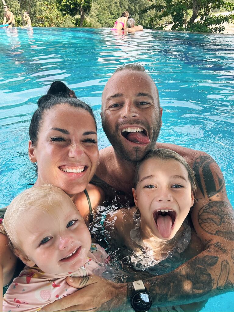 Family of four having fun in the pool of Pullman Phuket Arcadia Naithon Beach