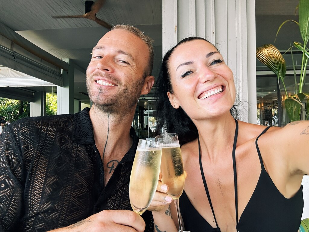 Couple cheering with champagne glasses