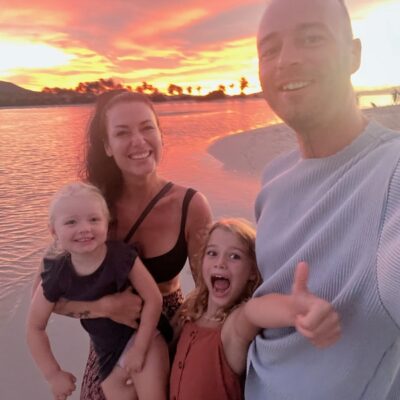 Family on the beach during sunset