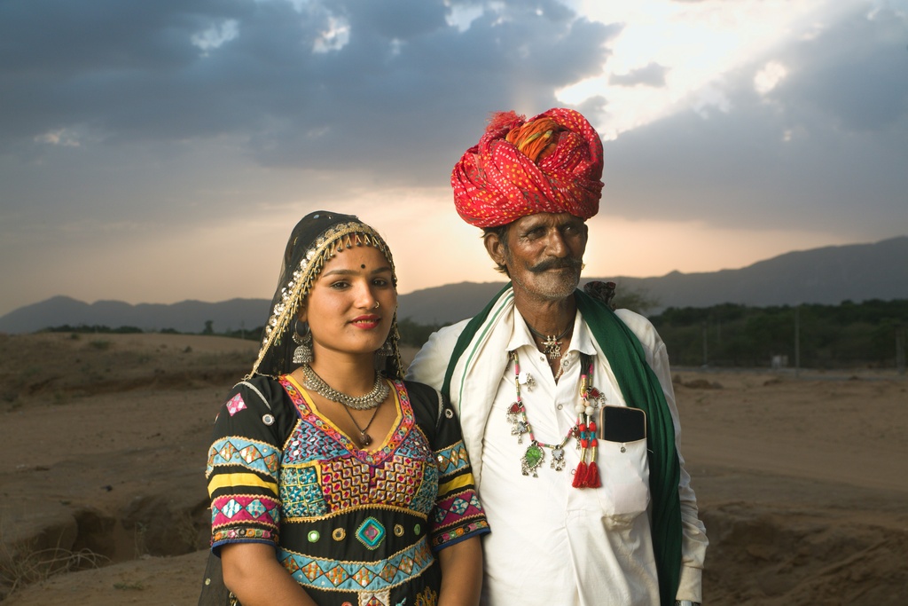 Indian couple standing next to each other