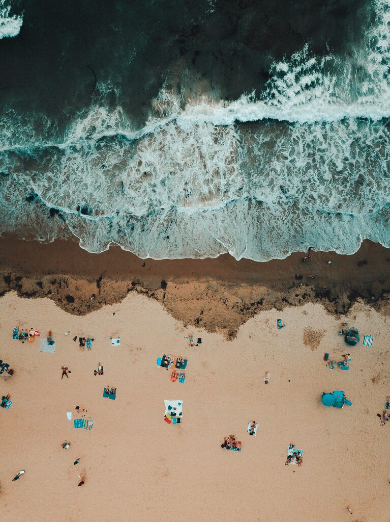 Beach with people from above, beach packing list family