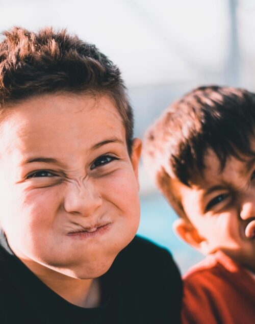 Two boys making a funny face