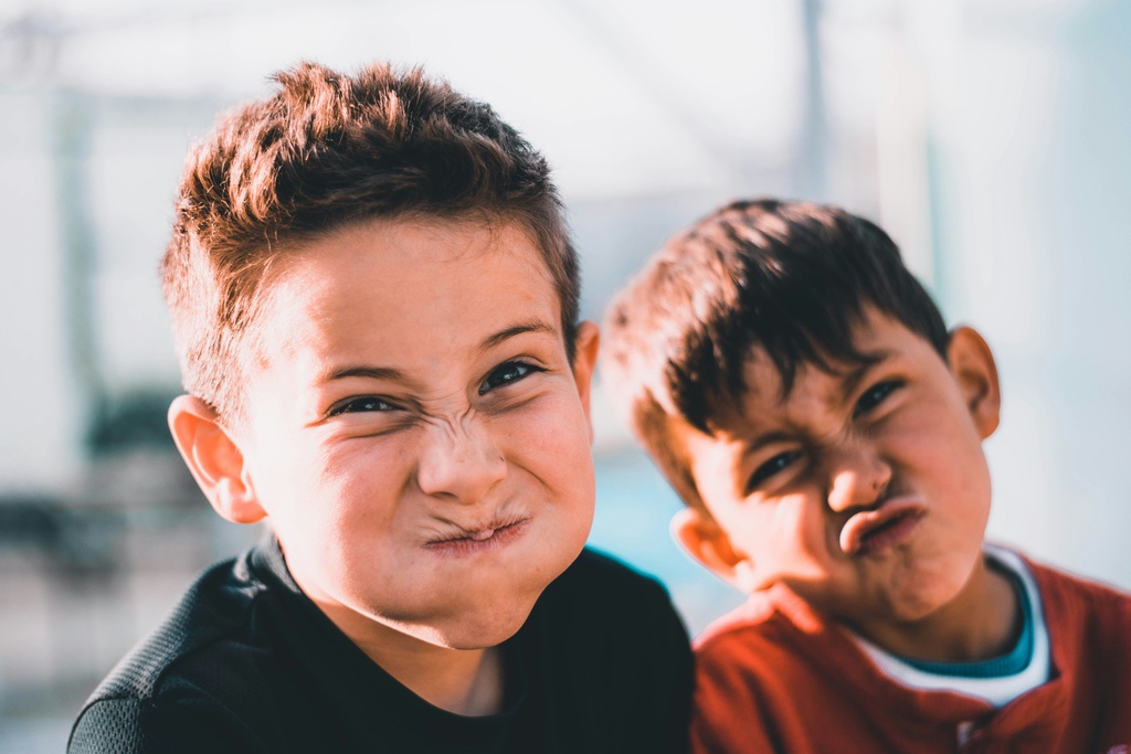 Two boys making a funny face