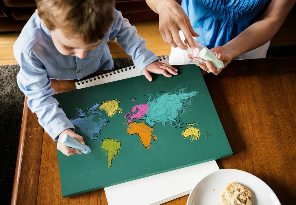 Kids drawing a world map