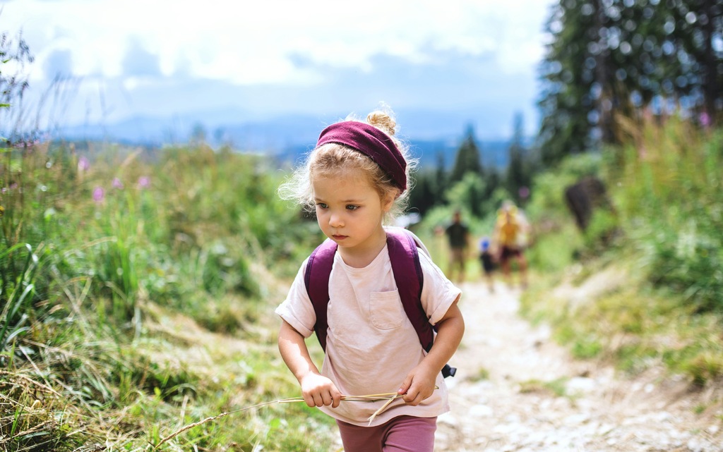 Young girl hiking in nature