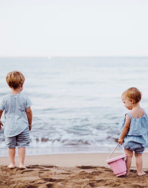 Two toddlers at the beach