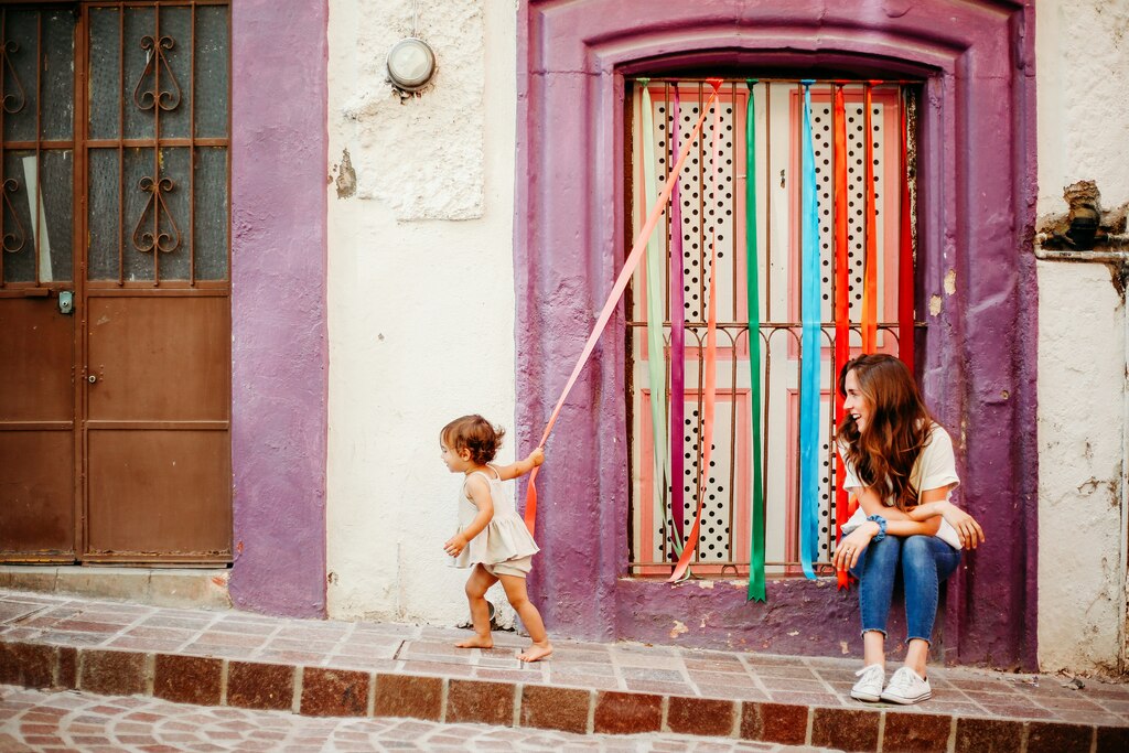 Woman with her young daughter playing