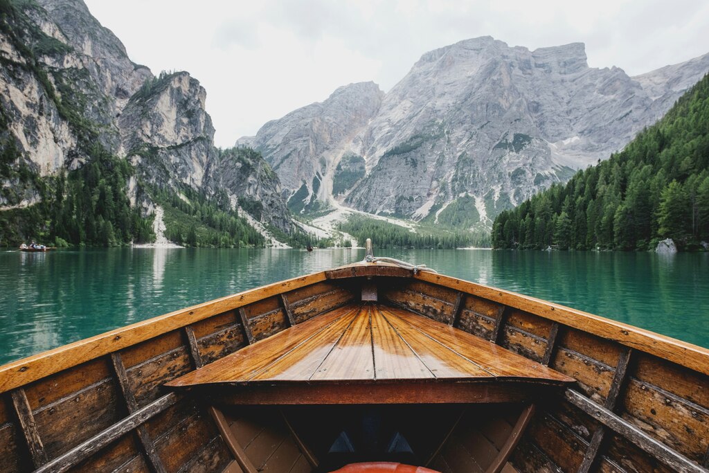 Small Boat in a lake surrounded by mountains