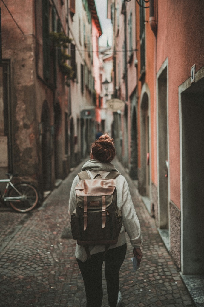 Woman walking through a road in Europe