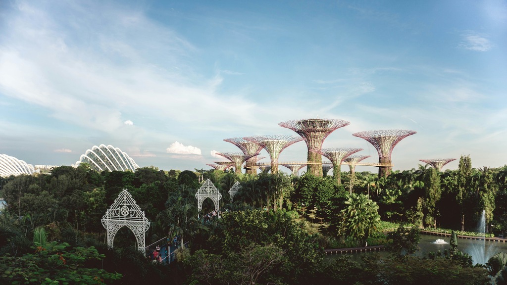 Metallic trees in lush green forest