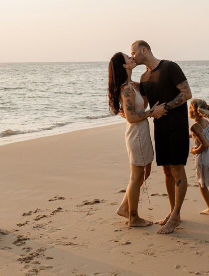 Family of four on a tropical beach.