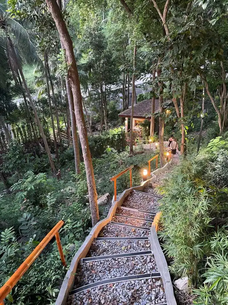 Stone stairs in jungle environment at Navana Water Healing Center Koh Phangan