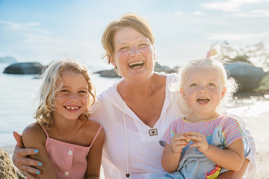 Grandma with her grandchildren on the beach, Koh Phangan for Seniors