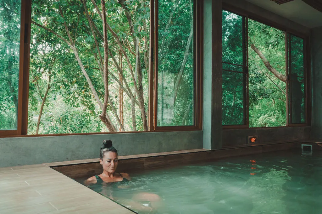 Woman sitting in Onsen Pool.