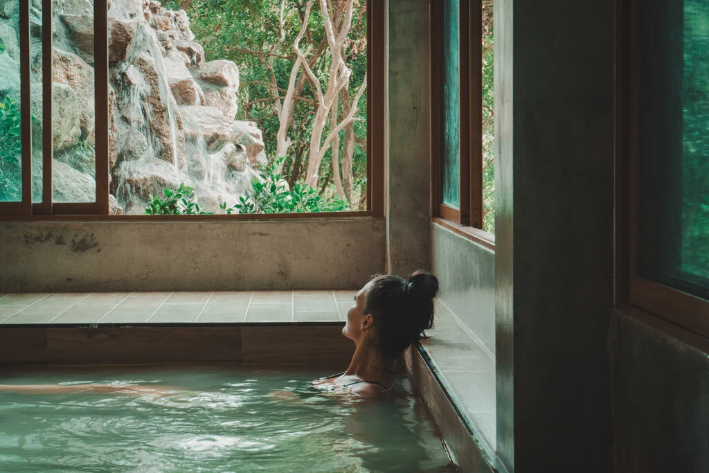 Woman bathing in Onsen pool.