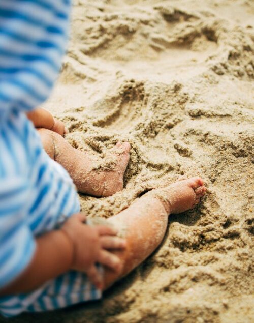 Baby feet on sand