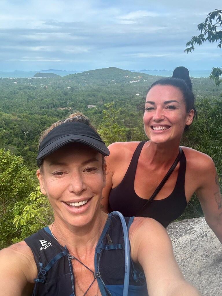 Two woman taking a selfie on a view point.